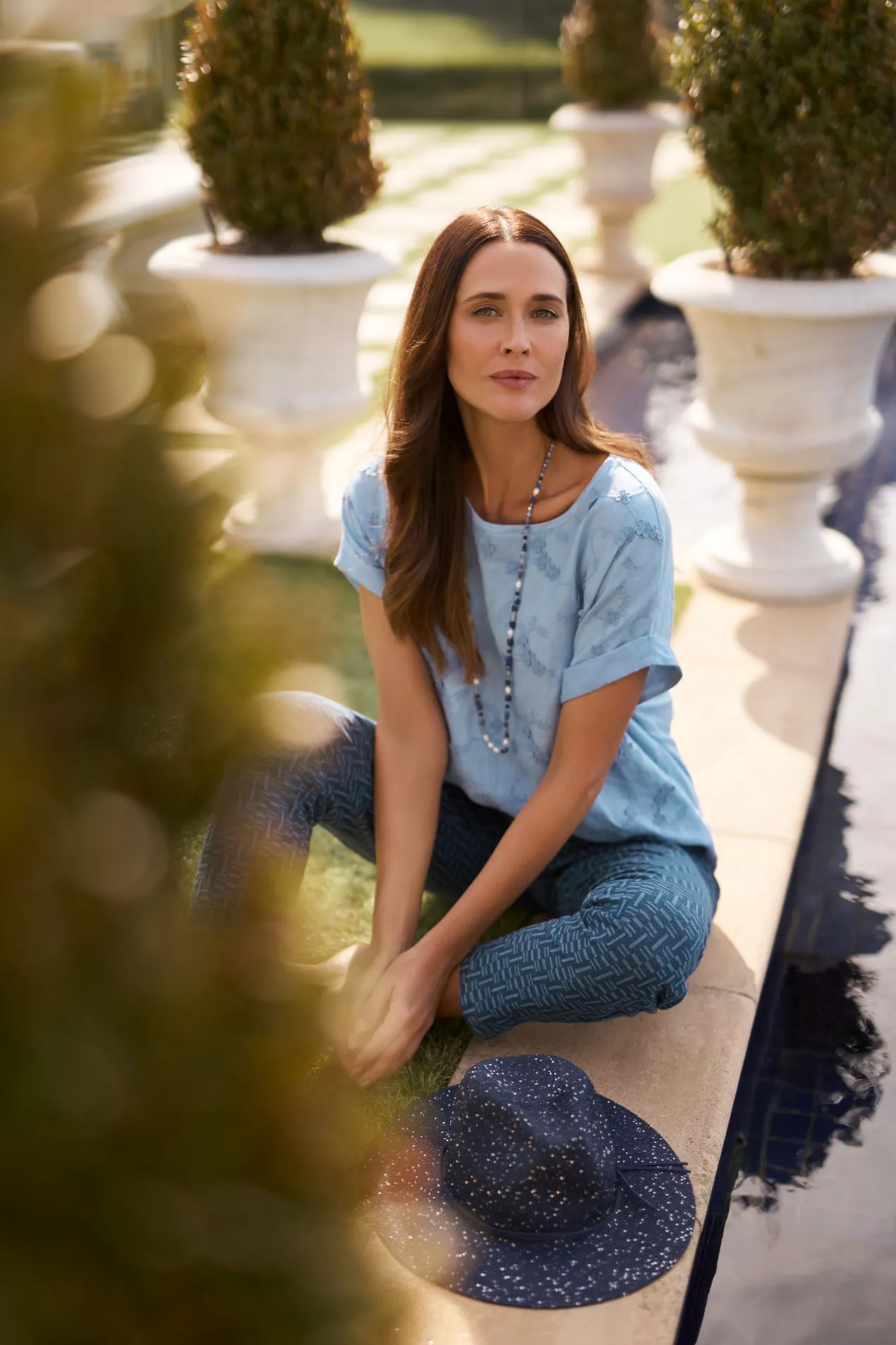Mixed Linen Floral T-Shirt + Bengajean 7/8th Slim Leg + Navy Shimmer Weave Fedora + Chianna Navy Necklace